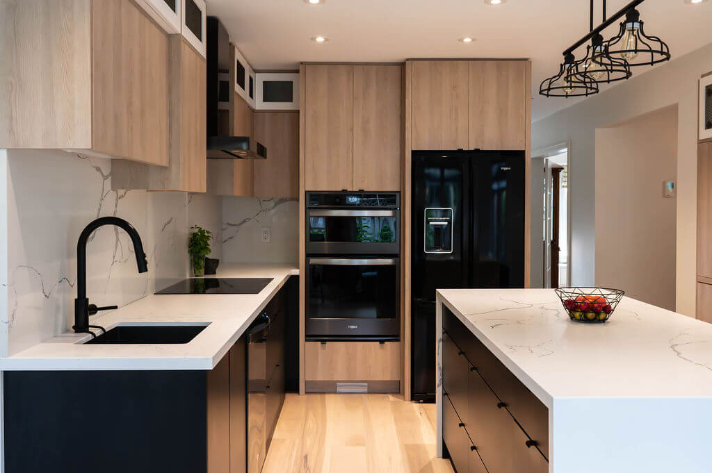 Minimalist black edge pulls on contemporary flat-panel kitchen cabinetry