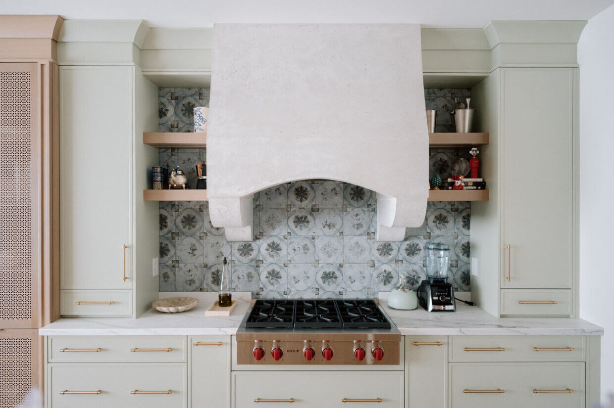 Sleek wooden pull handles installed on large modern kitchen cabinets