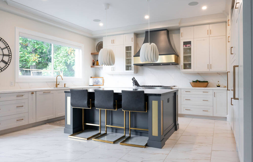 These white painted cabinets create a bright, open space, with subtle Art Deco notes.